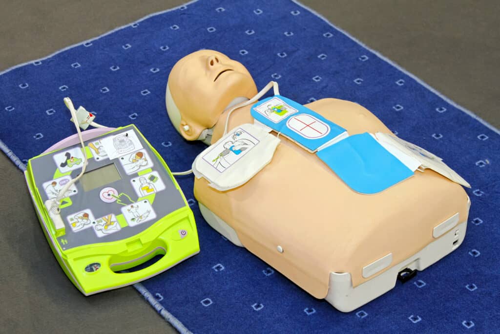 Automated External Defibrillator with training dummy mannequin
