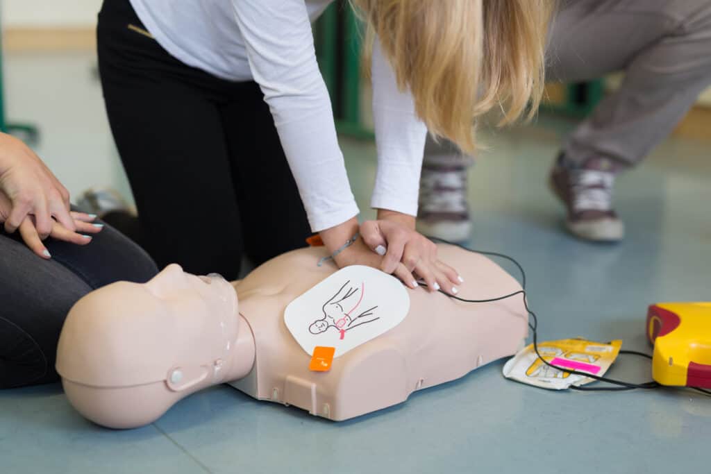 First aid cardiopulmonary resuscitation course using automated external defibrillator device, AED.