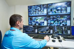 Security video surveillance. security guard monitoring surveillance cameras CCTV.