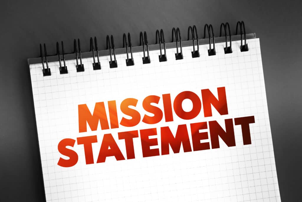 Mission Statement text on notepad, concept background
